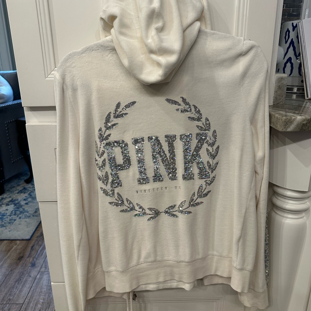 Velour Vintage “PINK” track suit withWreath Logo in “like new” condition.